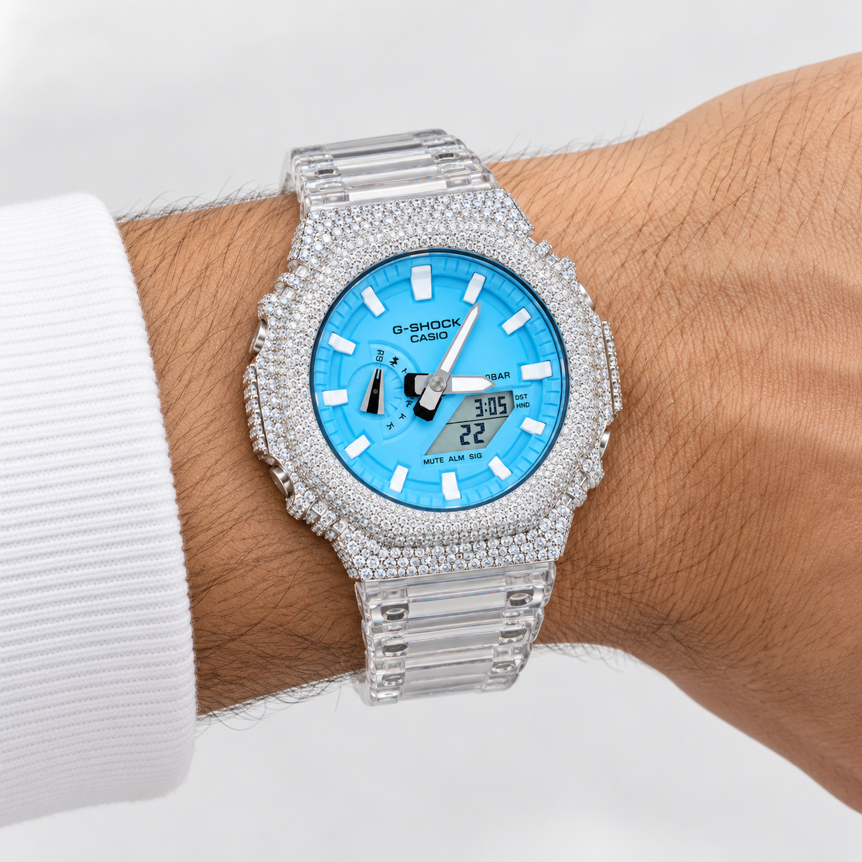 Iced out G-Shock clear band blue dial watch on wrist