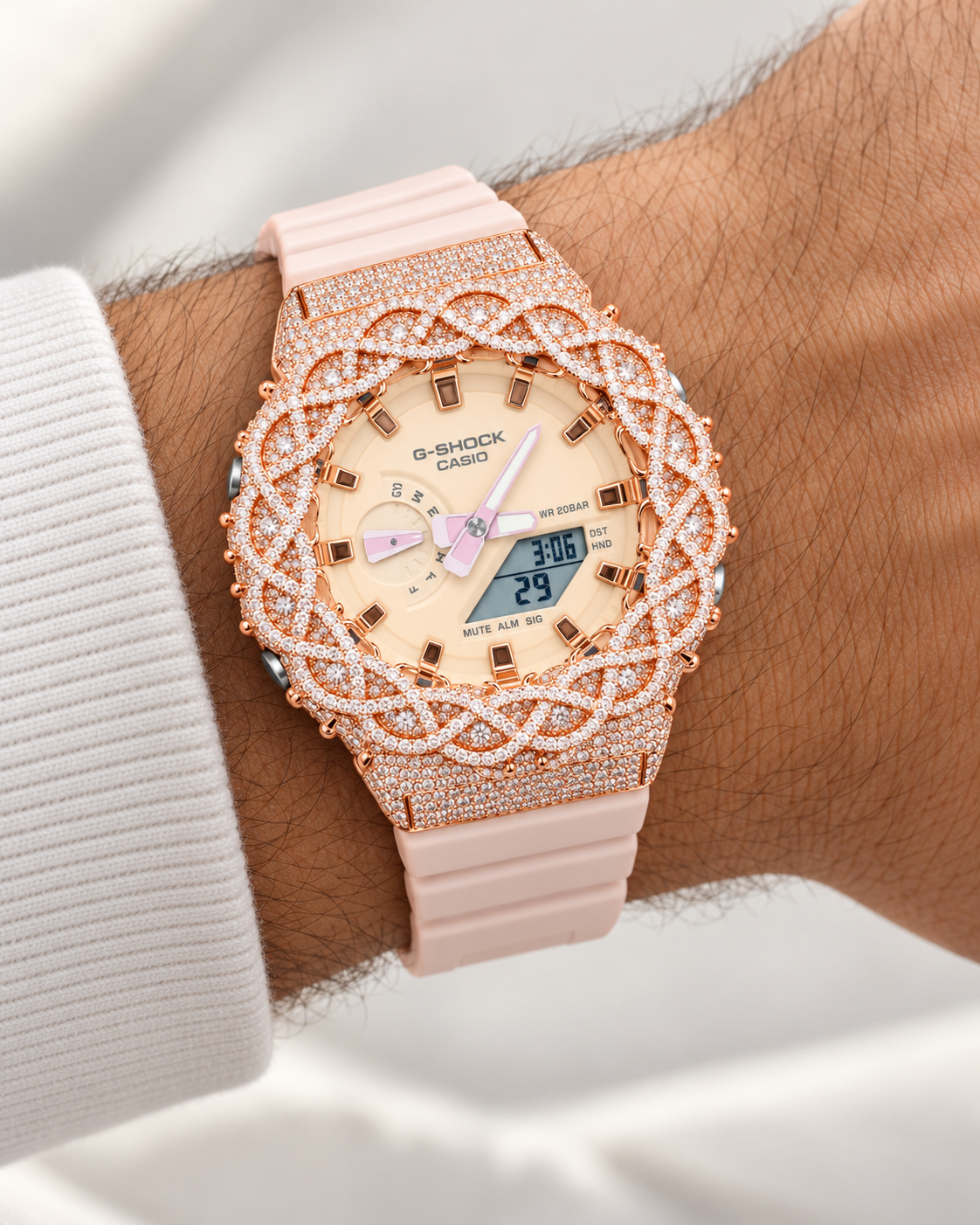 Iced out rose gold G-Shock watch on wrist