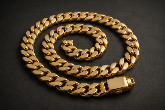 A polished Miami Cuban link gold chain coiled into a spiral with a box-lock clasp