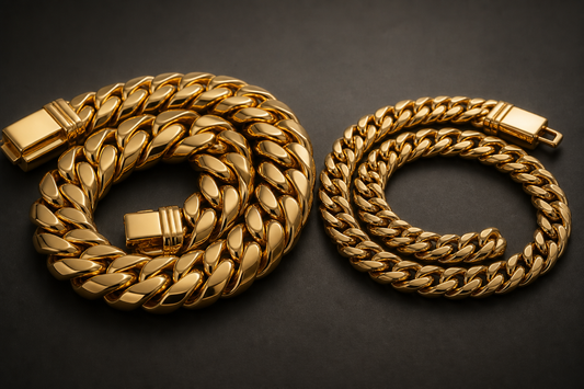 A heavy solid gold Cuban link chain beside a lighter hollow gold Cuban chain