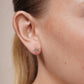 Diamond-cut star flower stud earrings in 14 karat gold, detail view