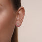 Beaded disc stud earrings in 14 karat yellow gold, detail view