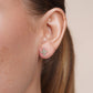 Diamond-cut confetti cross stud earrings in 14 karat gold, detail view