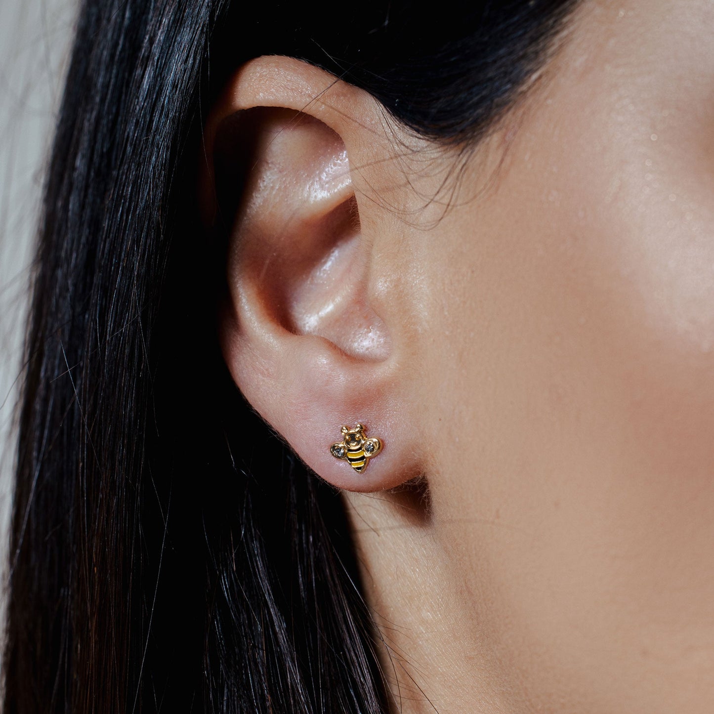 14K yellow gold bee stud earrings with black and yellow enamel and clear CZ