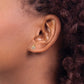 14K gold CZ ladybug stud earring worn on the ear