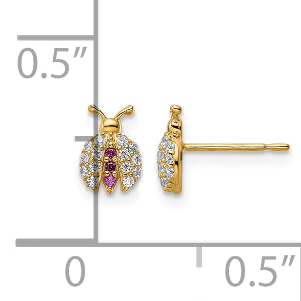 14K gold CZ ladybug stud earrings next to a half inch scale