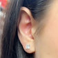Square moissanite stud earrings in 14 karat yellow gold, side view