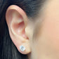 Round moissanite stud earrings in 14 karat yellow gold, side view