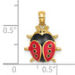3D 14K gold ladybug charm next to a half inch scale
