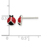 Sterling silver ladybug stud earrings next to a half inch scale