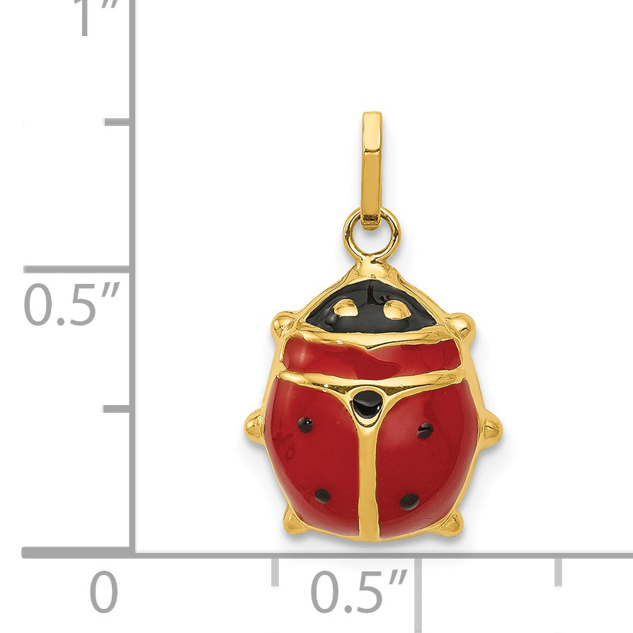 14K gold enamel ladybug charm next to a half inch scale