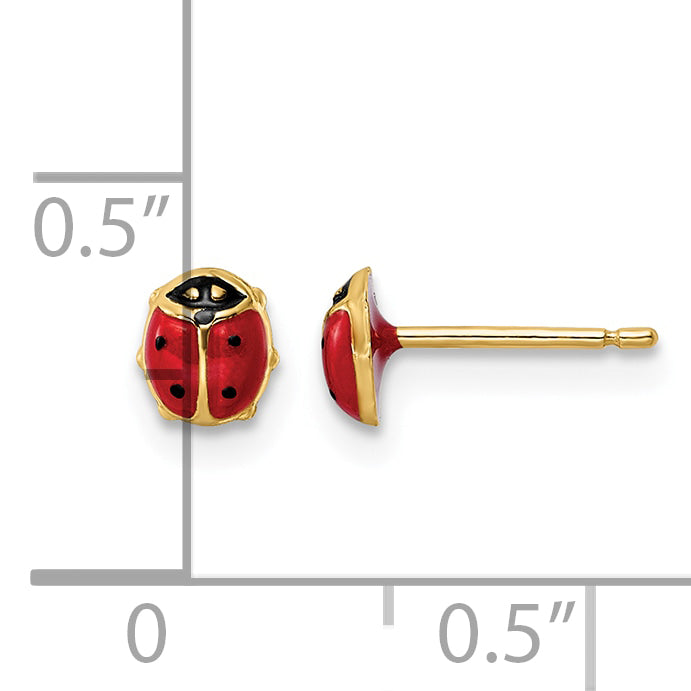 14K gold ladybug stud earrings next to a half inch scale