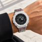 Iced out G-Shock circuit pattern band watch on wrist