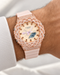 Iced out rose gold G-Shock watch on wrist